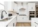 Bright kitchen with stainless steel sink, quartz countertop, and subway tile backsplash at 16467 Alps Rd, Noblesville, IN 46060