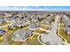 A high angle aerial view shows suburban homes with green lawns and mature trees at 16544 Gaither Ct, Westfield, IN 46074