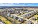 An aerial view shows homes in a suburban neighborhood with mature trees at 16544 Gaither Ct, Westfield, IN 46074