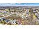 An aerial shot shows a community with various home styles and lush landscaping at 16544 Gaither Ct, Westfield, IN 46074