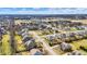 A high angle aerial view of suburban homes with green lawns on a sunny day at 16544 Gaither Ct, Westfield, IN 46074