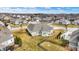An aerial view showcases a well-planned residential area with lush lawns and meticulously designed homes on a bright day at 16544 Gaither Ct, Westfield, IN 46074