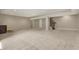Spacious basement featuring neutral walls and carpet, plus a convenient wet bar and staircase at 16544 Gaither Ct, Westfield, IN 46074