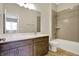 Modern bathroom with a large vanity, tiled shower, and a large mirror that adds depth to the space at 16544 Gaither Ct, Westfield, IN 46074