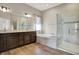 Luxurious bathroom features double vanity, soaking tub, a walk-in shower, and modern lighting at 16544 Gaither Ct, Westfield, IN 46074
