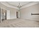 Large bedroom with tray ceilings, recessed lighting, carpeting, and ensuite bathroom at 16544 Gaither Ct, Westfield, IN 46074