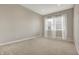 Bright, carpeted bedroom featuring a large window with natural light, and neutral wall color at 16544 Gaither Ct, Westfield, IN 46074