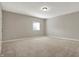 A cozy bedroom featuring neutral walls, plush carpeting, and a bright window at 16544 Gaither Ct, Westfield, IN 46074