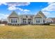 Charming home featuring a manicured lawn, stone accents, and inviting entrance at 16544 Gaither Ct, Westfield, IN 46074