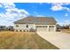Spacious three-car garage and well-maintained lawn enhance this home's curb appeal at 16544 Gaither Ct, Westfield, IN 46074