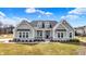 Beautiful home with stone accents, dormer windows, and a well-manicured front yard at 16544 Gaither Ct, Westfield, IN 46074