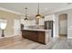 Modern kitchen featuring a large island, stainless steel appliances, and ample cabinet space at 16544 Gaither Ct, Westfield, IN 46074