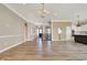 Open concept living room with hardwood floors, elegant lighting, and staircase at 16544 Gaither Ct, Westfield, IN 46074