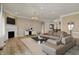 Staged living room featuring modern sofa, fireplace, and stylish decor at 16544 Gaither Ct, Westfield, IN 46074