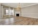 Elegant living room featuring hardwood floors, fireplace, and plenty of natural light at 16544 Gaither Ct, Westfield, IN 46074