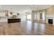 Open-concept space features hardwood floors, a modern kitchen, and natural light at 16544 Gaither Ct, Westfield, IN 46074