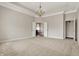 Spacious carpeted main bedroom boasts a tray ceiling with chandelier and ensuite bathroom at 16544 Gaither Ct, Westfield, IN 46074