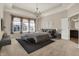 Staged main bedroom with carpet, tray ceiling, chandelier, and coordinated furniture at 16544 Gaither Ct, Westfield, IN 46074