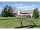 Expansive backyard with mature trees, lush lawn, and a spacious wooden deck perfect for entertaining at 1667 Decourcy Ct, Franklin, IN 46131