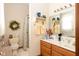 Well-lit bathroom featuring a shower, toilet and vanity with ample counter space and storage at 1667 Decourcy Ct, Franklin, IN 46131