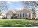 Lovely home with green shutters, brick exterior, and a well-manicured lawn and landscaping at 1667 Decourcy Ct, Franklin, IN 46131