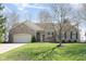 Charming ranch home featuring a brick exterior, attached garage, and well-maintained lawn and landscaping at 1667 Decourcy Ct, Franklin, IN 46131
