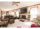 Spacious living room with a brick fireplace, neutral tones, and comfortable seating for relaxing at 1667 Decourcy Ct, Franklin, IN 46131