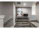 Finished basement area with gray walls, neutral carpet, desk, and decorative seascape art at 17099 Cole Evans Dr, Noblesville, IN 46060