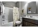 Well-lit bathroom with a bathtub, shower, decorative curtain, and a vanity at 17099 Cole Evans Dr, Noblesville, IN 46060