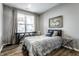 Cozy bedroom with natural light, stylish decor, and a comfortable bed at 17099 Cole Evans Dr, Noblesville, IN 46060