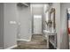 Elegant entryway featuring hardwood floors, decorative table, and stylish front door at 17099 Cole Evans Dr, Noblesville, IN 46060