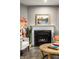 Cozy fireplace with mantle and hearth in the living room at 17099 Cole Evans Dr, Noblesville, IN 46060