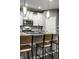 Modern kitchen featuring stainless steel appliances, sleek white cabinets and a large kitchen island at 17099 Cole Evans Dr, Noblesville, IN 46060