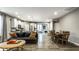Bright, open-concept layout connecting the living room, dining area, and kitchen with hardwood floors at 17099 Cole Evans Dr, Noblesville, IN 46060