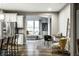 Open concept living area with modern decor, stainless steel appliances, and hardwood floors at 17099 Cole Evans Dr, Noblesville, IN 46060