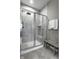 Contemporary shower with glass enclosure, tile walls, a shower bench, and modern fixtures at 17099 Cole Evans Dr, Noblesville, IN 46060