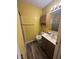 Bathroom featuring tiled shower, toilet, vanity, and storage cabinet for toiletries at , Indianapolis, IN 46219