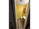 Bright bathroom with yellow walls, a vanity, a toilet, and shower stall at , Indianapolis, IN 46219