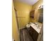 Bright bathroom with yellow walls, a vanity, a toilet, and shower stall at , Indianapolis, IN 46219