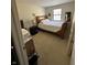 Bedroom with a wood-framed bed, light walls, and carpet at , Indianapolis, IN 46219