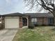 Charming single story brick home with attached garage, and mature landscaping in a quiet neighborhood at , Indianapolis, IN 46219