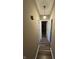 Hallway leading to bedrooms, with neutral paint, hardwood floors and modern lighting at , Indianapolis, IN 46219