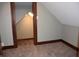 Cozy attic space with sloped ceilings and neutral carpet at 189 S Jefferson St, Martinsville, IN 46151