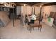 Unfinished basement featuring a concrete floor, exposed duct work and miscellaneous items at 189 S Jefferson St, Martinsville, IN 46151