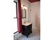 Bathroom with elegant vanity, decorative mirror, and black and white mosaic tile at 189 S Jefferson St, Martinsville, IN 46151