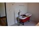 Claw foot tub featuring tile floors and ample space at 189 S Jefferson St, Martinsville, IN 46151