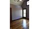 Well-lit bedroom featuring hardwood floors, high ceilings, and decorative trim at 189 S Jefferson St, Martinsville, IN 46151
