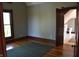 Bedroom with hardwood floors, a large window, and an open bathroom entrance at 189 S Jefferson St, Martinsville, IN 46151