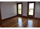 Bedroom featuring hardwood floors, decorative trim and filled with natural light at 189 S Jefferson St, Martinsville, IN 46151