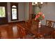A formal dining room offers a chandelier and wooden floors at 189 S Jefferson St, Martinsville, IN 46151